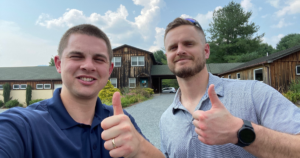 two reliable payments team members giving the thumbs up